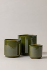 Set of three Terracotta glazed plant pots of different sizes in green color