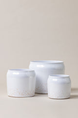 set of three Terracotta glazed plant pots of different sizes in white color