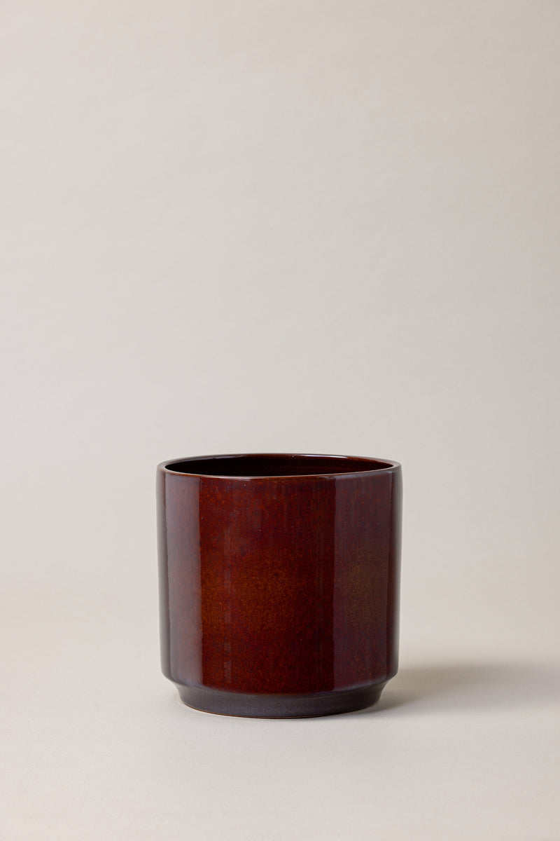 Terracotta glazed plant pot in brown color