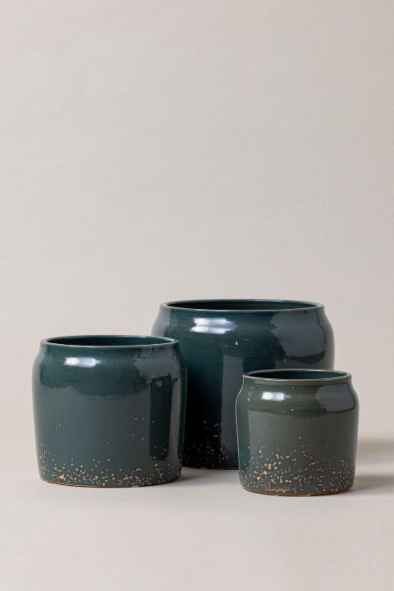 set of three Terracotta glazed plant pots of different sizes in juniper green color