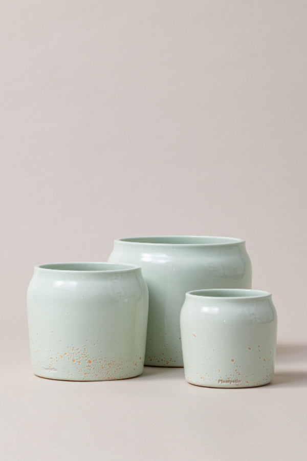 set of three Terracotta glazed plant pots of different sizes in mint green color