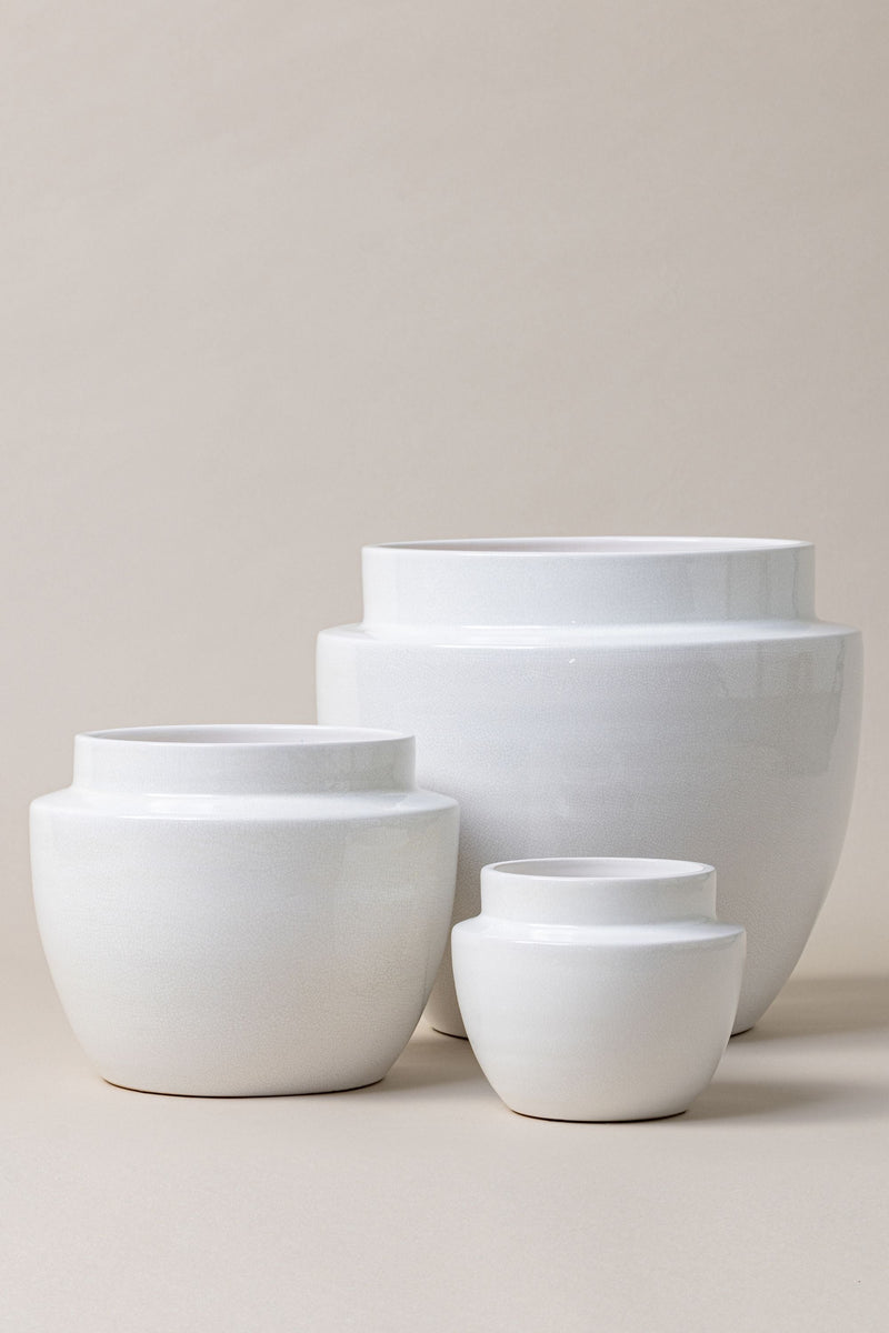 set of three Terracotta glazed plant pots of different sizes in white color