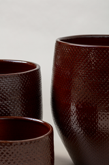 Set of 3 terracotta glazed plant pot in dark brown color with different sizes.