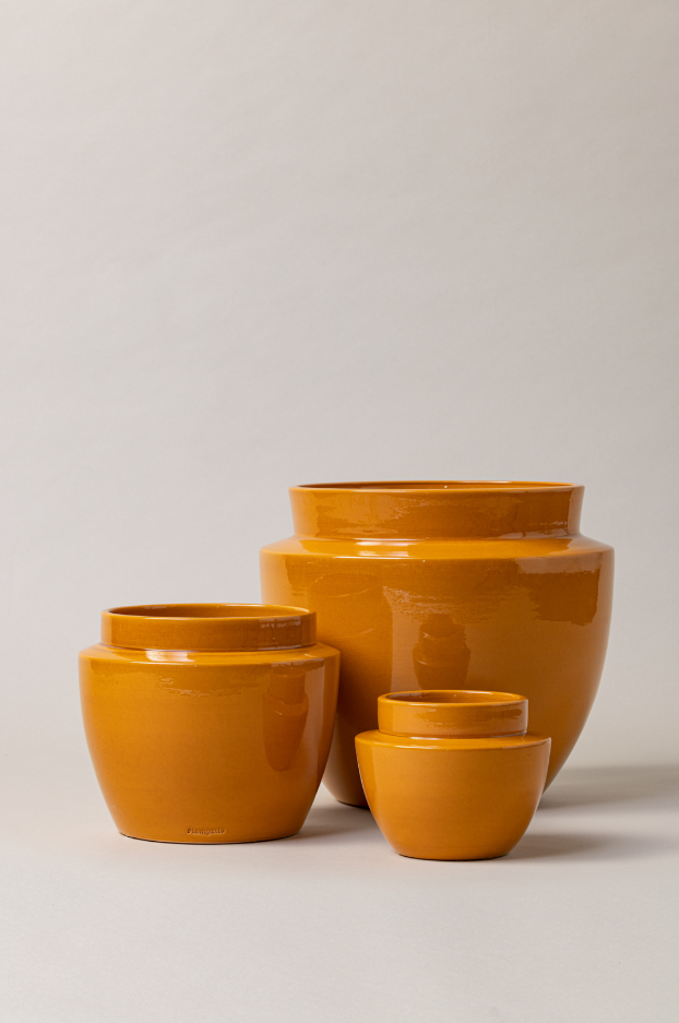 set of three Terracotta glazed plant pots in yellow color